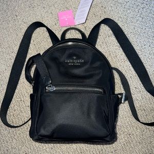 Black Kate Spade Chelsea backpack, never used, with gold detailing/ hardware.